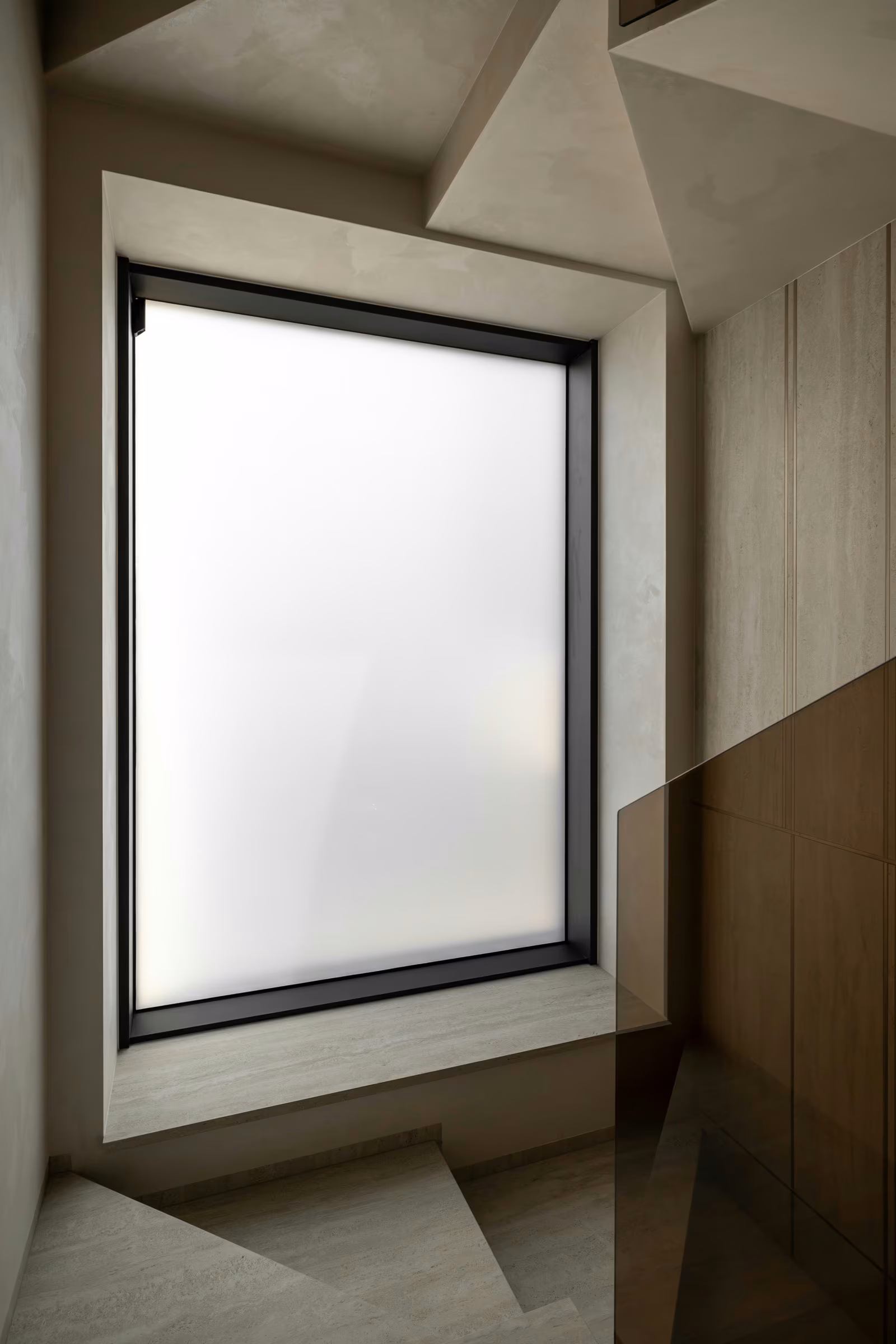Translucent window in an interior with neutral finishes.