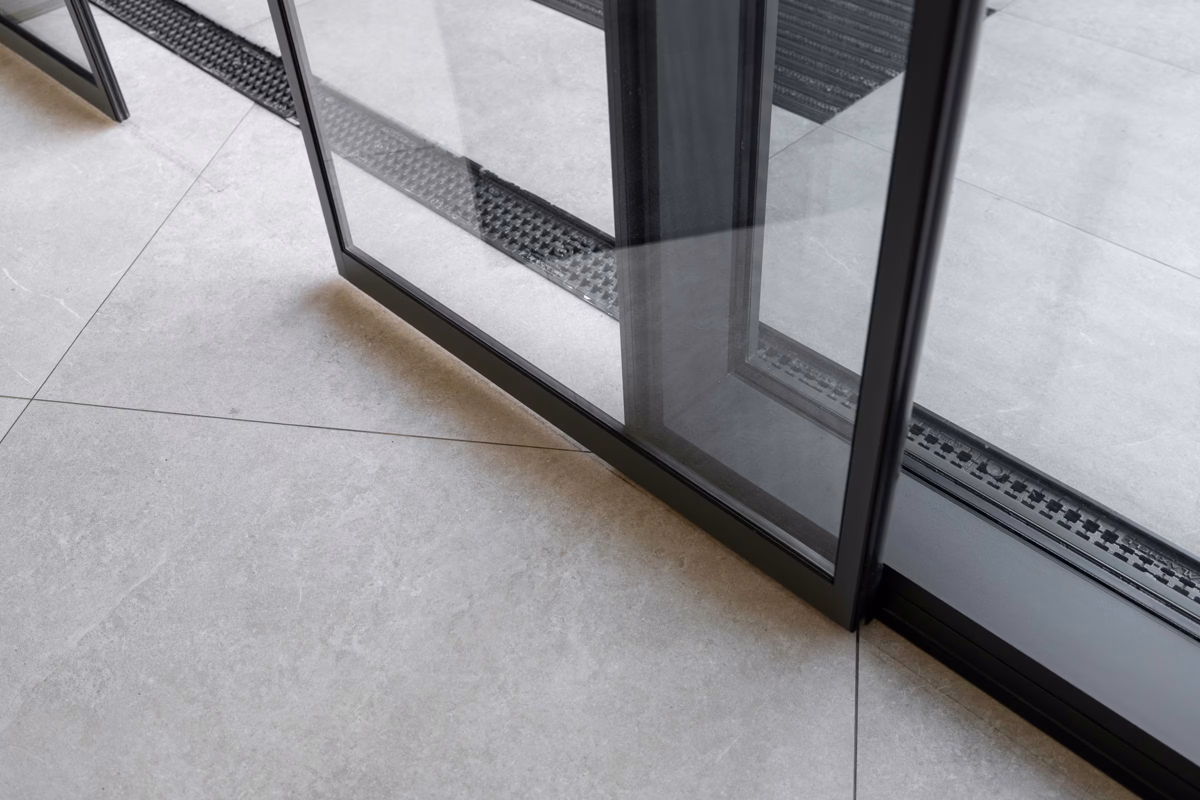 Glazed entrance element integrated into the pharmacy frontage.