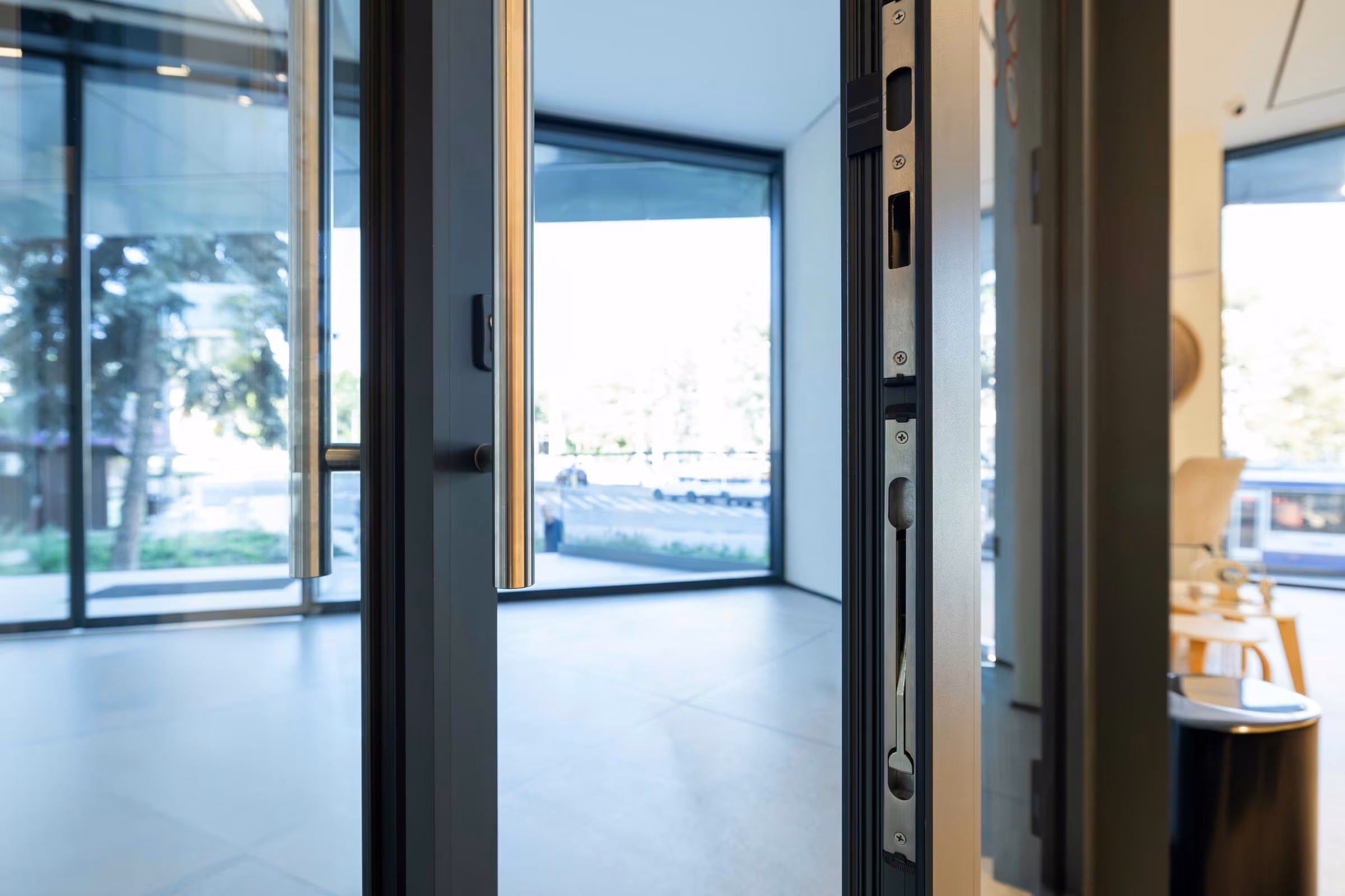 Composition of metal framing and glazing within the commercial space.